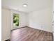Bright bedroom with hardwood flooring, large window, and neutral colored walls at 3531 Bon Rea Dr, Charlotte, NC 28226