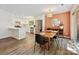 Inviting dining area features modern lighting, stylish decor, and connects seamlessly to the kitchen at 3531 Bon Rea Dr, Charlotte, NC 28226