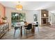 Inviting dining room featuring a fireplace, a view to the lake, and plenty of natural light at 3531 Bon Rea Dr, Charlotte, NC 28226