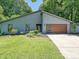 Contemporary home featuring a modern garage door, well-manicured lawn, and clean architectural lines at 3531 Bon Rea Dr, Charlotte, NC 28226