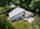 Stylish home with a contemporary design, well-manicured lawn, and a modern garage, surrounded by lush greenery and mature trees at 3531 Bon Rea Dr, Charlotte, NC 28226