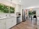 Modern kitchen offering views to the dining room with stainless appliances and white cabinetry at 3531 Bon Rea Dr, Charlotte, NC 28226