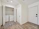 Laundry room with side by side washer and dryer, bi-fold doors, and a door to the outside at 3531 Bon Rea Dr, Charlotte, NC 28226
