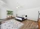 Bright main bedroom featuring vaulted ceilings, plank flooring, and a lovely outdoor view at 3531 Bon Rea Dr, Charlotte, NC 28226