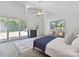 Spacious main bedroom with access to outdoor deck with nature views and vaulted ceilings at 3531 Bon Rea Dr, Charlotte, NC 28226