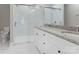 Bathroom featuring double sinks with granite counters and large glass shower at 501 Old Speedway Nw Dr # 1, Concord, NC 28027