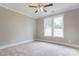 Neutral bedroom featuring carpet, a ceiling fan, and natural light at 501 Old Speedway Nw Dr # 1, Concord, NC 28027