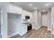 Well-equipped kitchen with stainless steel appliances, white cabinets, and granite countertops at 501 Old Speedway Nw Dr # 1, Concord, NC 28027