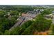 Aerial view of townhome community with mature trees, sidewalks, and convenient neighborhood amenities at 513 Cubitt Ct, Charlotte, NC 28205