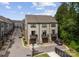 Aerial view showcasing modern townhouses, garages, and private balconies in a neatly planned community at 513 Cubitt Ct, Charlotte, NC 28205