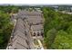 View of new construction townhomes in a well-planned neighborhood with mature trees and city skyline at 513 Cubitt Ct, Charlotte, NC 28205