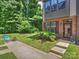 Well-maintained front yard with a walkway leading to the townhome's entrance at 513 Cubitt Ct, Charlotte, NC 28205