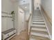 Entryway with a coat rack and staircase, showcasing modern design elements at 513 Cubitt Ct, Charlotte, NC 28205