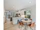Bright open concept connecting dining and living space to the modern kitchen at 513 Cubitt Ct, Charlotte, NC 28205