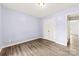 Neutral bedroom with hard wood floors and closet with double doors at 522 Klondike Ln, Charlotte, NC 28216