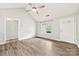 Bright living room with vaulted ceiling, hard wood floors, neutral walls and a new white front door at 522 Klondike Ln, Charlotte, NC 28216
