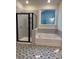 Bright bathroom features a walk-in shower and a soaking tub near a large window at 5239 Scotts Creek Rd, Indian Land, SC 29707