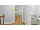 Hallway leading to a bathroom with modern fixtures and luxury vinyl flooring at 5414 Leaford Ct, Charlotte, NC 28227