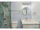 Newly renovated bathroom featuring updated fixtures, blue tiling, and modern lighting at 5414 Leaford Ct, Charlotte, NC 28227