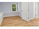Bedroom with light blue walls, vinyl floors, and a window seat at 5414 Leaford Ct, Charlotte, NC 28227