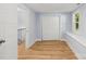 Bedroom featuring a closet, wood floors, a window seat, and light blue walls at 5414 Leaford Ct, Charlotte, NC 28227
