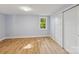 Bedroom featuring light blue walls, a window seat, wood floors, and a closet at 5414 Leaford Ct, Charlotte, NC 28227