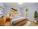 Cozy bedroom features a queen bed, modern decor, and plenty of natural light at 5414 Leaford Ct, Charlotte, NC 28227