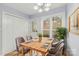 Charming dining room with a wooden table, seating for four, and a bright window view at 5414 Leaford Ct, Charlotte, NC 28227
