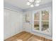 Mudroom featuring a large window, a white door to the backyard, and lots of storage space at 5414 Leaford Ct, Charlotte, NC 28227
