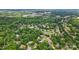 Expansive aerial view showcases a neighborhood with mature trees and well-maintained homes at 6324 Old Fox Hunt Ln, Mint Hill, NC 28227