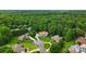 Aerial shot of a stately home with lush green surroundings in a quiet residential area at 6324 Old Fox Hunt Ln, Mint Hill, NC 28227