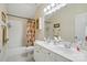 Bathroom with double vanity sinks, shower and tub combination at 6324 Old Fox Hunt Ln, Mint Hill, NC 28227