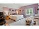 Bright bedroom with neutral carpet, decorations, and a window at 6324 Old Fox Hunt Ln, Mint Hill, NC 28227