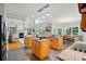 Spacious open-concept kitchen featuring granite counters, pendant lighting, and view into Gathering room at 6324 Old Fox Hunt Ln, Mint Hill, NC 28227