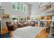Open-concept living room with high ceilings and views into the kitchen and dining area at 6324 Old Fox Hunt Ln, Mint Hill, NC 28227