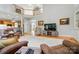 Spacious living room with balcony view of the staircase and an open kitchen at 6324 Old Fox Hunt Ln, Mint Hill, NC 28227