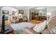 Living room featuring hardwood floors, neutral walls, area rug and view into the dining room at 6324 Old Fox Hunt Ln, Mint Hill, NC 28227