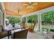 Covered patio featuring ceiling fans, ample seating, and view of the backyard at 6324 Old Fox Hunt Ln, Mint Hill, NC 28227