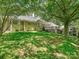 Expansive backyard with well-maintained lawn, mature trees, and a view of the home's exterior at 643 Baron Rd # 8, Waxhaw, NC 28173