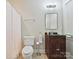 Bathroom with a dark vanity and a shower with a white curtain at 643 Baron Rd # 8, Waxhaw, NC 28173