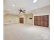 Large bonus room with carpet, recessed lighting and custom closet space at 643 Baron Rd # 8, Waxhaw, NC 28173