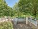 Multi-level deck overlooking the lake offers ample seating, dining areas, and wrought iron railings at 643 Baron Rd # 8, Waxhaw, NC 28173