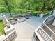 Spacious deck features comfortable seating, a modern fire pit, and scenic lake views at 643 Baron Rd # 8, Waxhaw, NC 28173