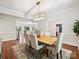 Elegant dining room featuring a stylish light fixture and views into the adjacent living spaces at 643 Baron Rd # 8, Waxhaw, NC 28173