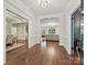 The grand foyer showcases beautiful hardwood floors, detailed trim, and views into adjacent living spaces at 643 Baron Rd # 8, Waxhaw, NC 28173