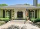 The property boasts a stylish black double door entry, framed by elegant columns and arched windows with shutters at 643 Baron Rd # 8, Waxhaw, NC 28173
