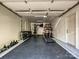 Garage converted to a home gym, complete with various weight training machines and equipment at 643 Baron Rd # 8, Waxhaw, NC 28173