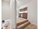 Hallway bar area featuring custom cabinetry, a beverage fridge, and granite countertops at 643 Baron Rd # 8, Waxhaw, NC 28173