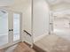 Second floor hallway with neutral carpet at 643 Baron Rd # 8, Waxhaw, NC 28173