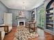 This sophisticated home office features built-in bookshelves, a cozy fireplace, and a large arched window at 643 Baron Rd # 8, Waxhaw, NC 28173